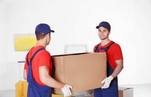 Removal company team preparing items for a UK house move