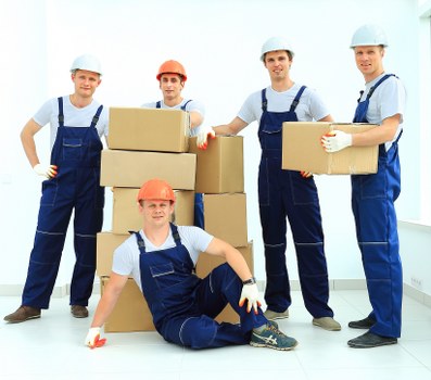Moving team planning a home move in Ilford residential street