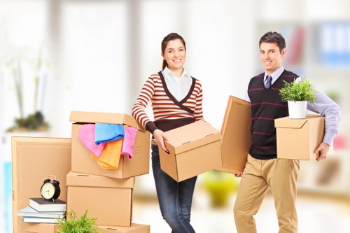 Family preparing boxes for a home move in Ilford