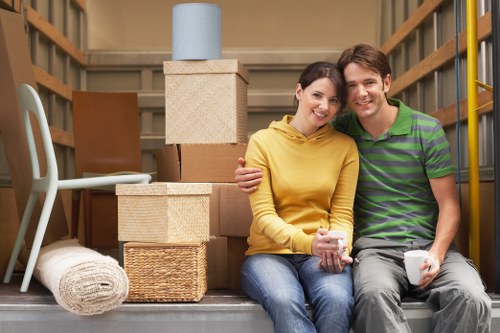 Packed boxes and furniture prepared for a local move in Ilford