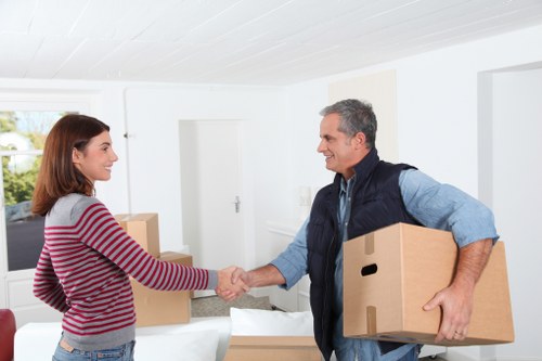 Loading boxes and household items into a van in Ilford