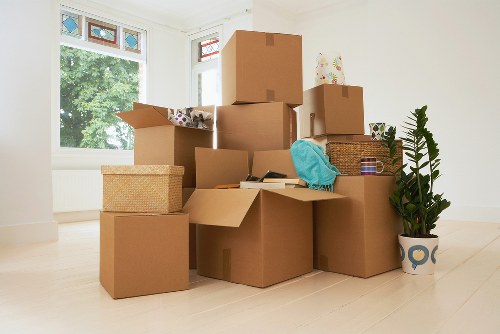 Professional movers handling home furniture in Ilford