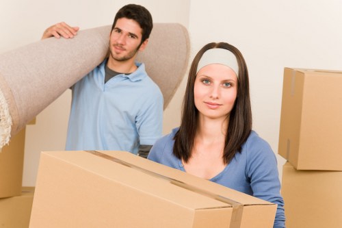 Packed household boxes and furniture ready for removal in Ilford