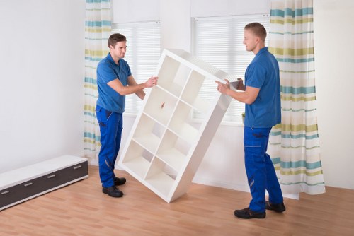 Local team loading furniture into a moving van in Ilford